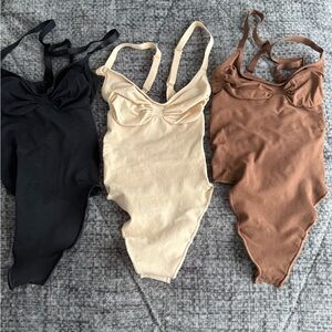 SKIMS Shapewear Bodysuit Trio - Black, Cream, and Brown